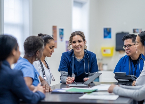 A group of doctors collaborating on patient care exchanging ideas and insights